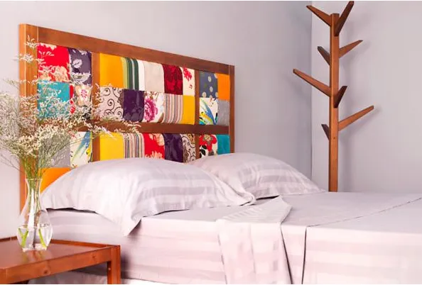 cama com cabeceira colorida em pachwork